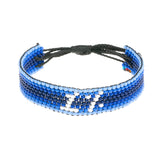 A handmade beaded bracelet from ArtiKen created in Kenya displaying the text 1%.