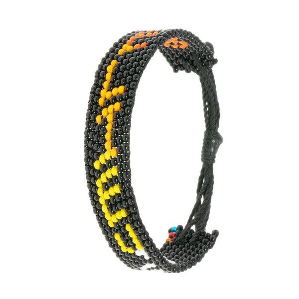 A handmade beaded bracelet from ArtiKen created in Kenya displaying the text Believe in vertical fashion.