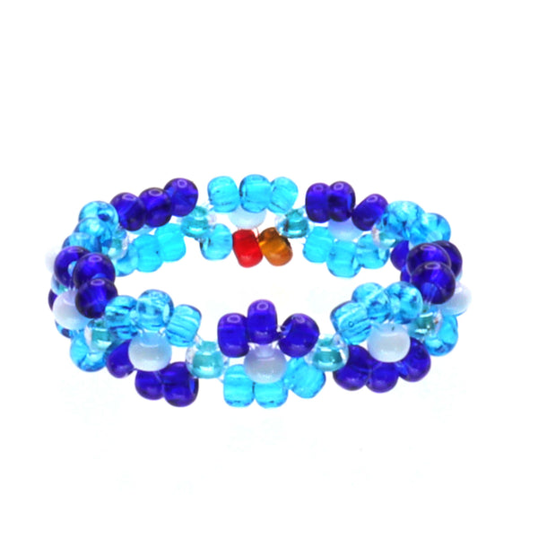 A handmade in Kenya, ArtiKen ring displays multiple blue beads mixed with white. 