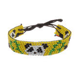 A handmade in Kenya, ArtiKen bracelet on a yellow background displays panda bears. 