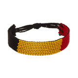 A beaded ArtiKen bracelet, handmade in Kenya, in Belgium colors, black, yellow, red.