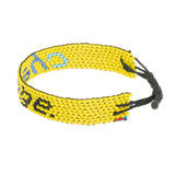 A handmade beaded bracelet from ArtiKen created in Kenya displaying the text Change.