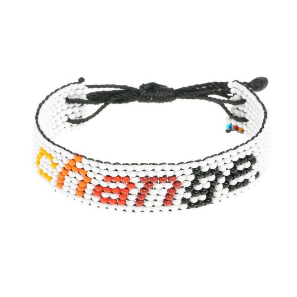 A handmade beaded bracelet from ArtiKen created in Kenya displaying the text Change.