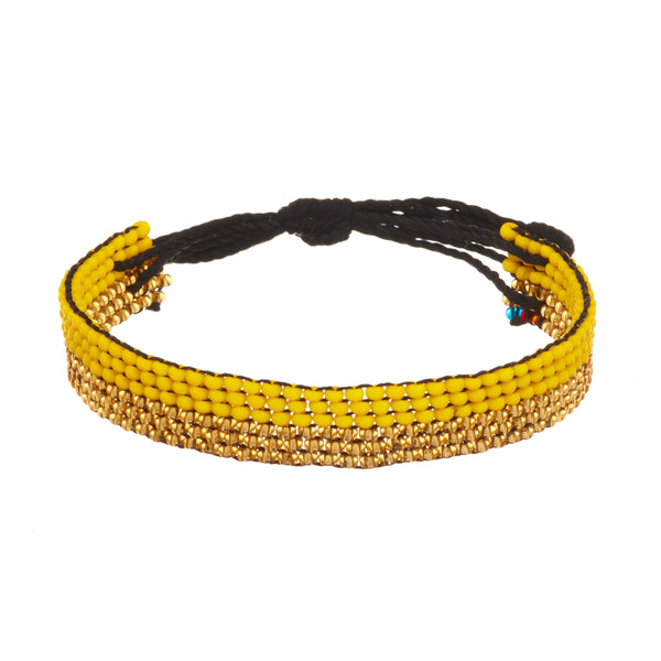 A beaded ArtiKen bracelet, handmade in Kenya, in support of raising Childhood Cancer awareness, in the colors of yellow and gold.  