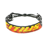 A handmade beaded bracelet from ArtiKen created in Kenya displaying the text Citius in black and yellow.
