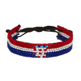 A beaded ArtiKen bracelet, handmade in Kenya, in Croatia flag colors, red, white, blue.
