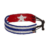 A beaded ArtiKen bracelet, handmade in Kenya, in Cuban flag colors, red, white, blue.