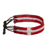 A beaded ArtiKen bracelet, handmade in Kenya, in Denmark flag colors, red, white.