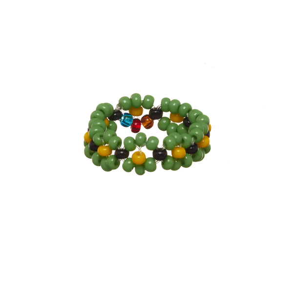 A beaded ArtiKen ring, handmade in Kenya, in green, yellow, and black beads.