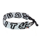 A handmade in Kenya, ArtiKen bracelet displays the word Equality in black and white beads. 