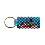 A beaded ArtiKen keychain, handmade in Kenya, displays a blue background and person on a jetski, in black, gray, orange, red, white.