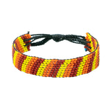 A handmade beaded bracelet from Kenya that displays different colored striped beads.