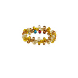 A beaded ArtiKen ring, handmade in Kenya, in yellow and clear beads.