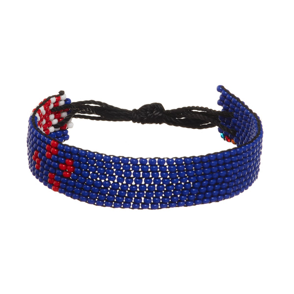 A beaded ArtiKen bracelet, handmade in Kenya, in New Zealand colors, red, blue, white.