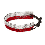A beaded ArtiKen bracelet, handmade in Kenya, in Poland flag colors, red, and white.