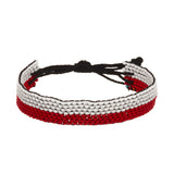A beaded ArtiKen bracelet, handmade in Kenya, in Poland flag colors, red, and white. 