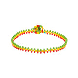 A handmade in Kenya ArtiKen bracelet displays the colors of green, yellow and red in our OG style. 