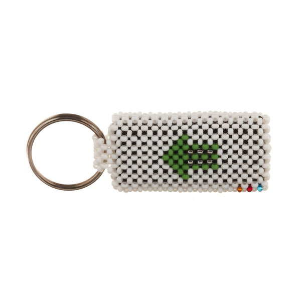 A beaded ArtiKen keychain, handmade in Kenya, displays a solid white background with an Olympic green arrow.