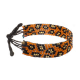 A handmade in Kenya, ArtiKen bracelet displays leopard spots. 