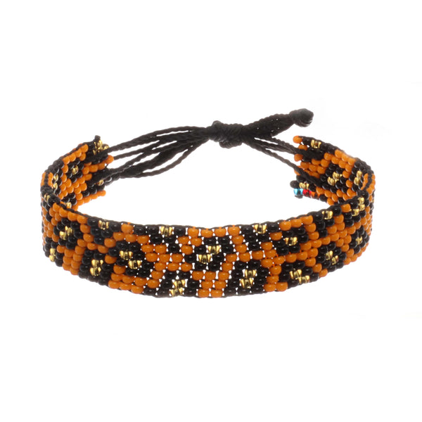 A handmade in Kenya, ArtiKen bracelet displays leopard spots. 