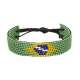 A beaded ArtiKen bracelet, handmade in Kenya, showcasing the Brazil flag in green, yellow, blue, and white. 